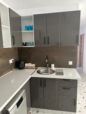 a kitchen with a sink and a counter top at Del Mar 1A - New Beach First floor apartment in Puerto de Sagunto