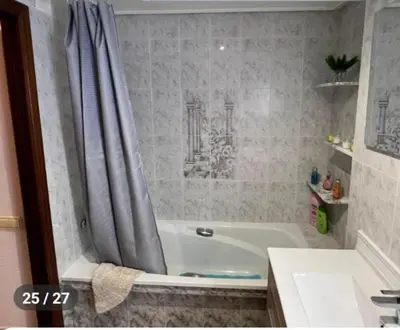 a bathroom with a bath tub and a sink at Apartamento en la Sierra Espadan in Artana
