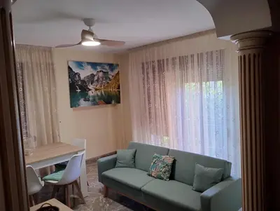 a living room with a couch and a window at Apartamento en la Sierra Espadan in Artana
