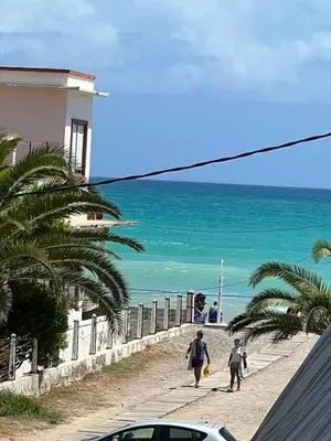 a man and two children walking down the beach at Moncofa Vistas Mar - Ideal Parejas in Moncófar