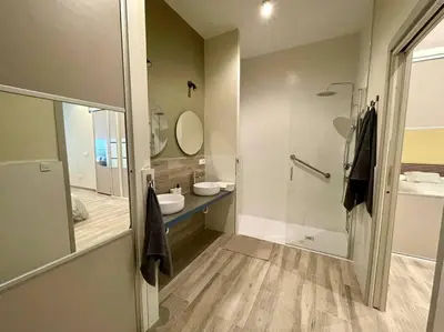 a bathroom with a shower and a sink and a mirror at Sensacional apartamento en Ruzafa in Valencia