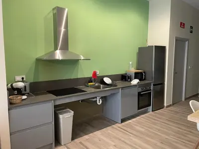 a kitchen with a sink and a refrigerator at Sensacional apartamento en Ruzafa in Valencia