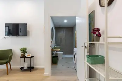 a room with a hallway with a sink and a bathroom at Loft nuevo cerca de Ruzafa y Ciudad de las Artes in Valencia