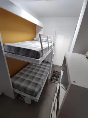 a small room with two bunk beds in it at Ca Salamandra in Albalat de Taronchers