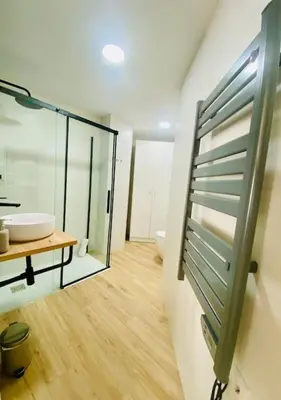 a bathroom with a sink and a glass door at BAJO A - Design & Comfort in Ruzafa SOHO in Valencia