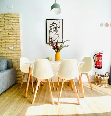 a dining room with a table and four chairs at BAJO A - Design & Comfort in Ruzafa SOHO in Valencia
