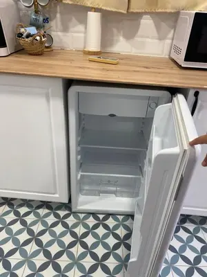 an open refrigerator in a kitchen with a counter at ALZIRA BONiTA LES BARRAQUES 2PAX in Alzira