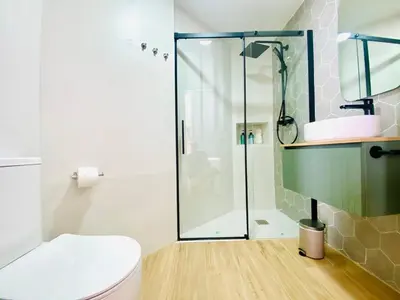 a bathroom with a shower and a toilet at BAJO B - Design & Comfort in Ruzafa SOHO in Valencia