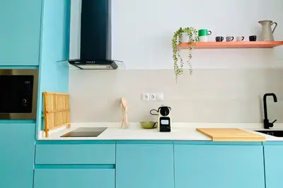 a kitchen with a blue and white counter top at BAJO C - Design & Comfort in Ruzafa SOHO in Valencia