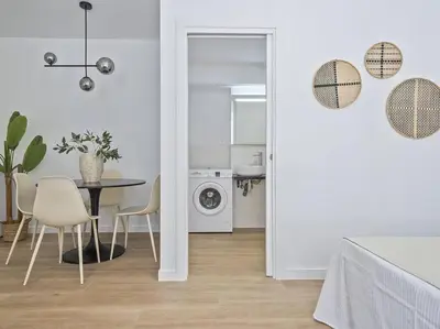 a kitchen and dining room with a table and chairs at Refugio Costero a 2 minutos de Playa Sagunto A4 in Puerto de Sagunto