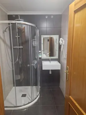 a bathroom with a shower and a sink at Canon,che in Alcántara de Júcar