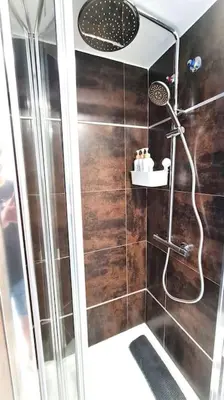 a bathroom with a shower with a glass door at E-Arenas Apartment with terrace in Edificio Arenas in Valencia