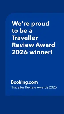 a blue sign that says were proud to be a traveller reviewagency winner at 100 metros playa con vistas al mar Piso nuevo 2024 in Cullera
