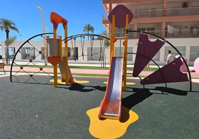 a playground with a slide in a park at 100 metros playa con vistas al mar Piso nuevo 2024 in Cullera
