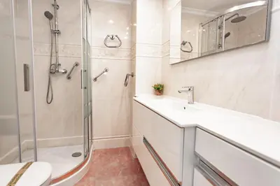 a bathroom with a shower and a sink and a toilet at Cullera Horizon Apartment in Cullera