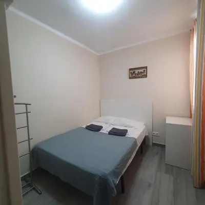 a bedroom with a bed in a white room at Apartamento Berenguer in Cullera