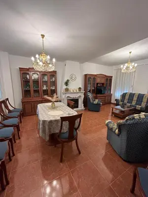 a large living room with a table and chairs at El Siprer in Anna