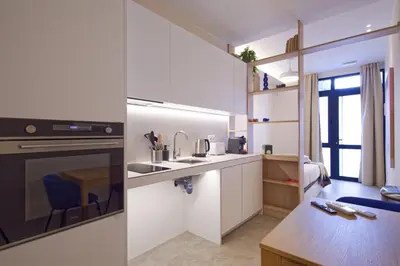 a kitchen with a sink and a stove top oven at Osito Hub - Justo y Pastor in Valencia