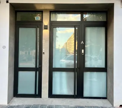 a pair of doors on a building at Osito Hub - Justo y Pastor in Valencia