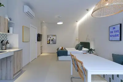 a living room with a table and a couch at Osito Hub - Esteban Ballester in Valencia