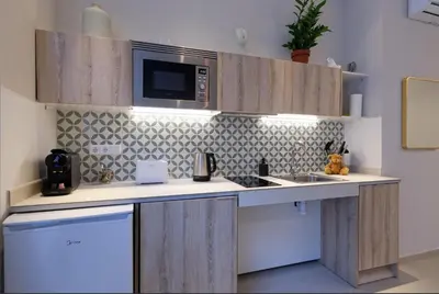 a kitchen with a sink and a microwave at Osito Hub - Esteban Ballester in Valencia