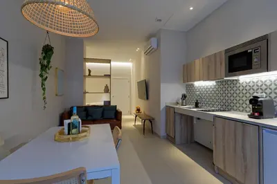 a kitchen and living room with a couch and a table at Osito Hub - Esteban Ballester in Valencia
