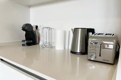 a kitchen counter with a coffee maker and a toaster at Gran Canet Vlado in Canet de Berenguer