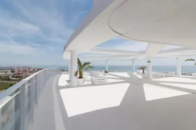 a white balcony with a view of the ocean at Gran Canet Vlado in Canet de Berenguer