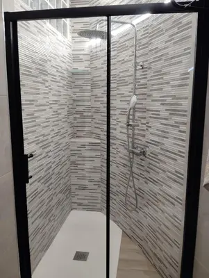 a shower with a glass door in a bathroom at Apartamento Plaza Palmeras2 in Burjasot