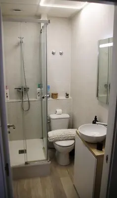 a bedroom with a bed with a white blanket at Flats Benimaclet in Valencia