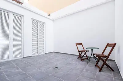 a dining room with two chairs and a table at La casa de la pintora by Concept Flats in Valencia