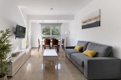 a living room with a couch and a table at GuestReady - Valencia Bliss near Malvarrosa Beach in Valencia