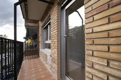 a glass door on the side of a brick building at GuestReady - Valencia Bliss near Malvarrosa Beach in Valencia