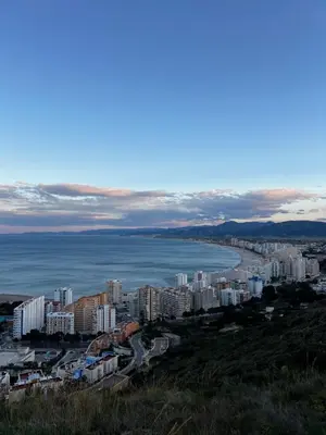 an aerial view of a city and the ocean at Apartamento con increíbles vistas a la bahía de Cullera in Faro de Cullera