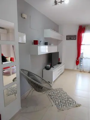 a living room with a glass table and a couch at Perla del mar in Moncófar