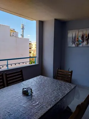 a dining room with a table with a heart on the wall at Perla del mar in Moncófar