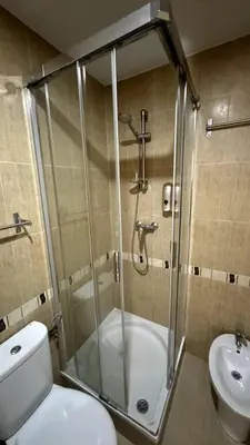 a bathroom with a shower and a toilet and a sink at Apartamentos Felip 3 in Burriana