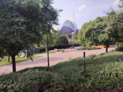 a view of a park with a building in the background at Turia Gardens Rooms - Authentic Valencia Downtown Parklife - VLC Urban Rental in Valencia