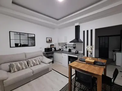 a living room with a couch and a table at Anthracita in Valencia