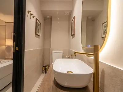 a bathroom with a white sink and a mirror at MD Nou Mestalla in Valencia