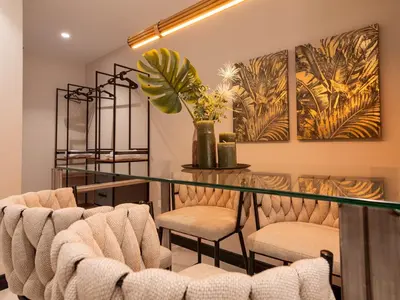 a dining room with chairs and a glass table at MD Nou Mestalla in Valencia