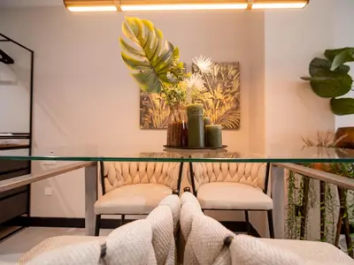 a room with two chairs and a glass table at MD Nou Mestalla in Valencia