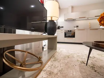a kitchen with a table and a dining room at MD Nou Mestalla in Valencia
