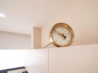 a clock sitting on top of a white cabinet at MD Nou Mestalla in Valencia