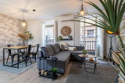 a living room with a couch and a table at Apartment in El Mercat in Valencia