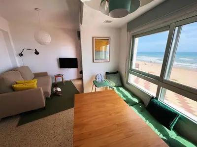a living room with a view of the beach at Valencia Frente al mar in Valencia