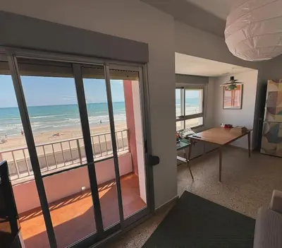 a living room with a view of the beach at Valencia Frente al mar in Valencia