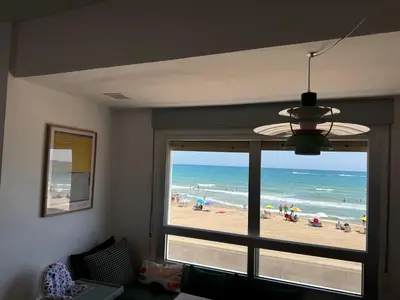 a room with a window with a view of the beach at Valencia Frente al mar in Valencia