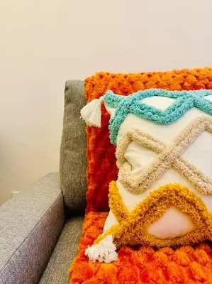 a cake sitting on top of a couch at Color & Design next to Russafa SOHO in Valencia
