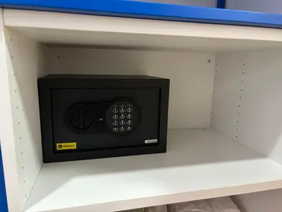 a microwave oven on a shelf in a shelf at Studio 1 Port Valencia in Valencia